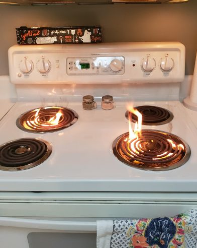oven cooktop on fire